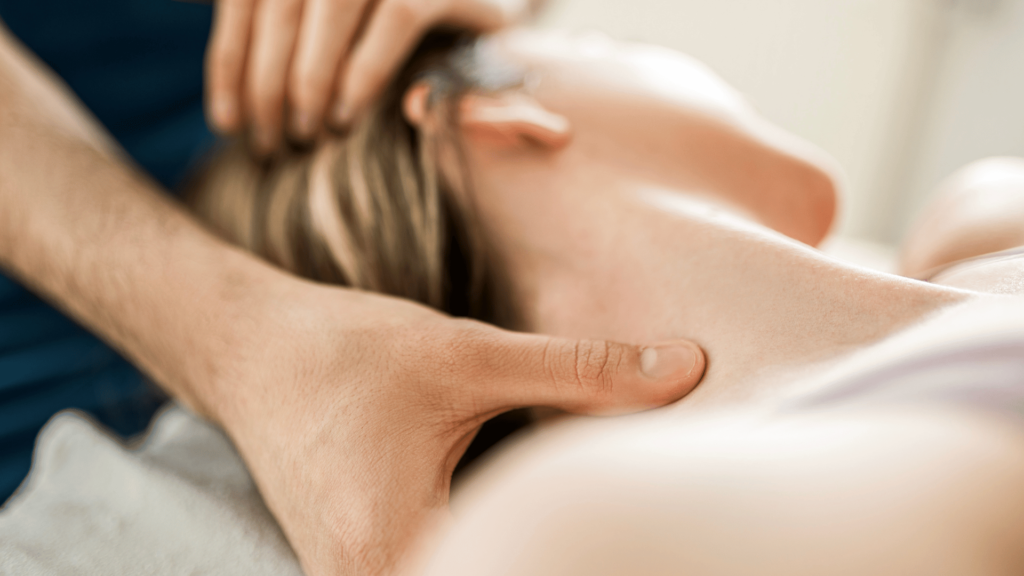 woman getting craniosacral therapy on her neck