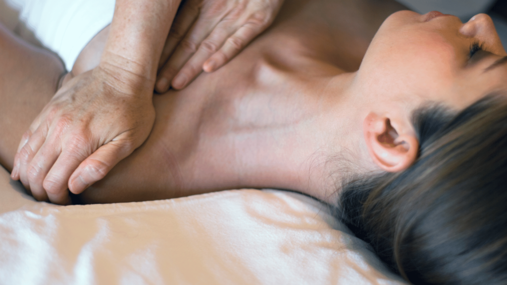 woman getting her shoulder massaged