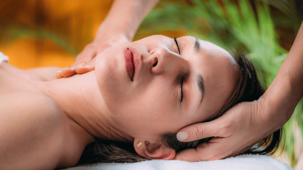 woman getting her head massaged