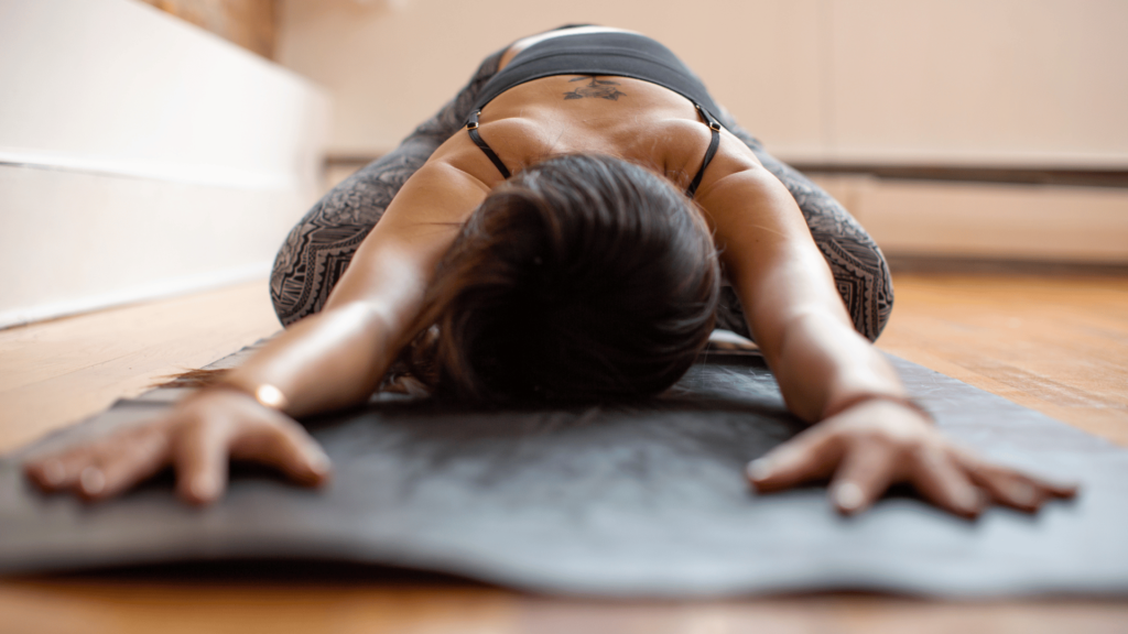 a woman doing a vinyasa flow yoga pose